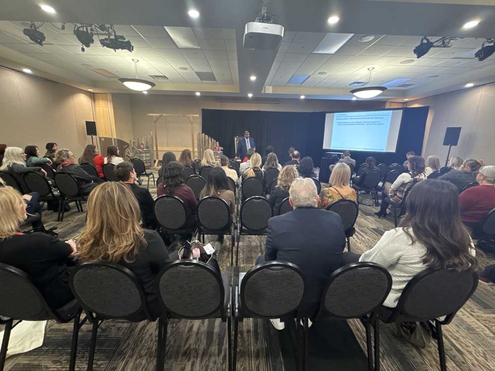 Planners discussing with clients about professional event management in Saskatoon.